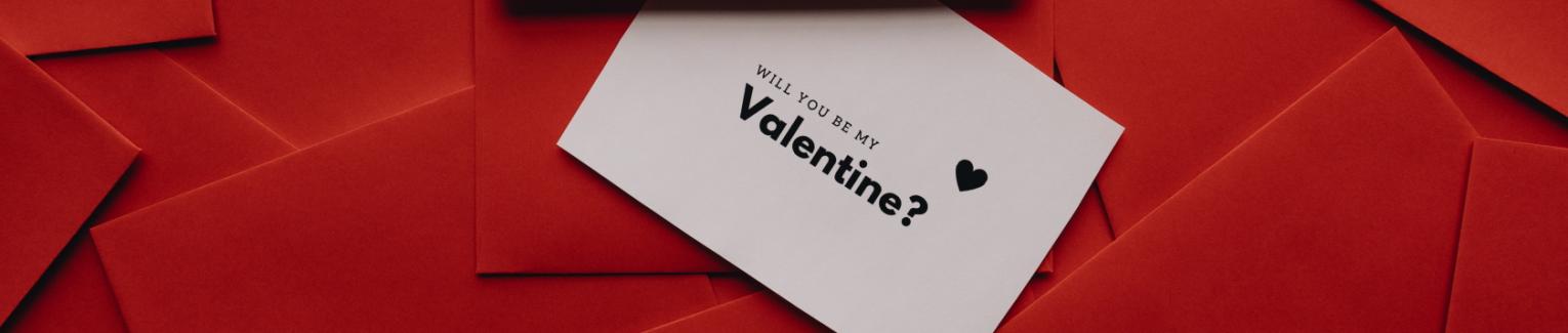 "Will you be my Valentine?" invitation on a red background